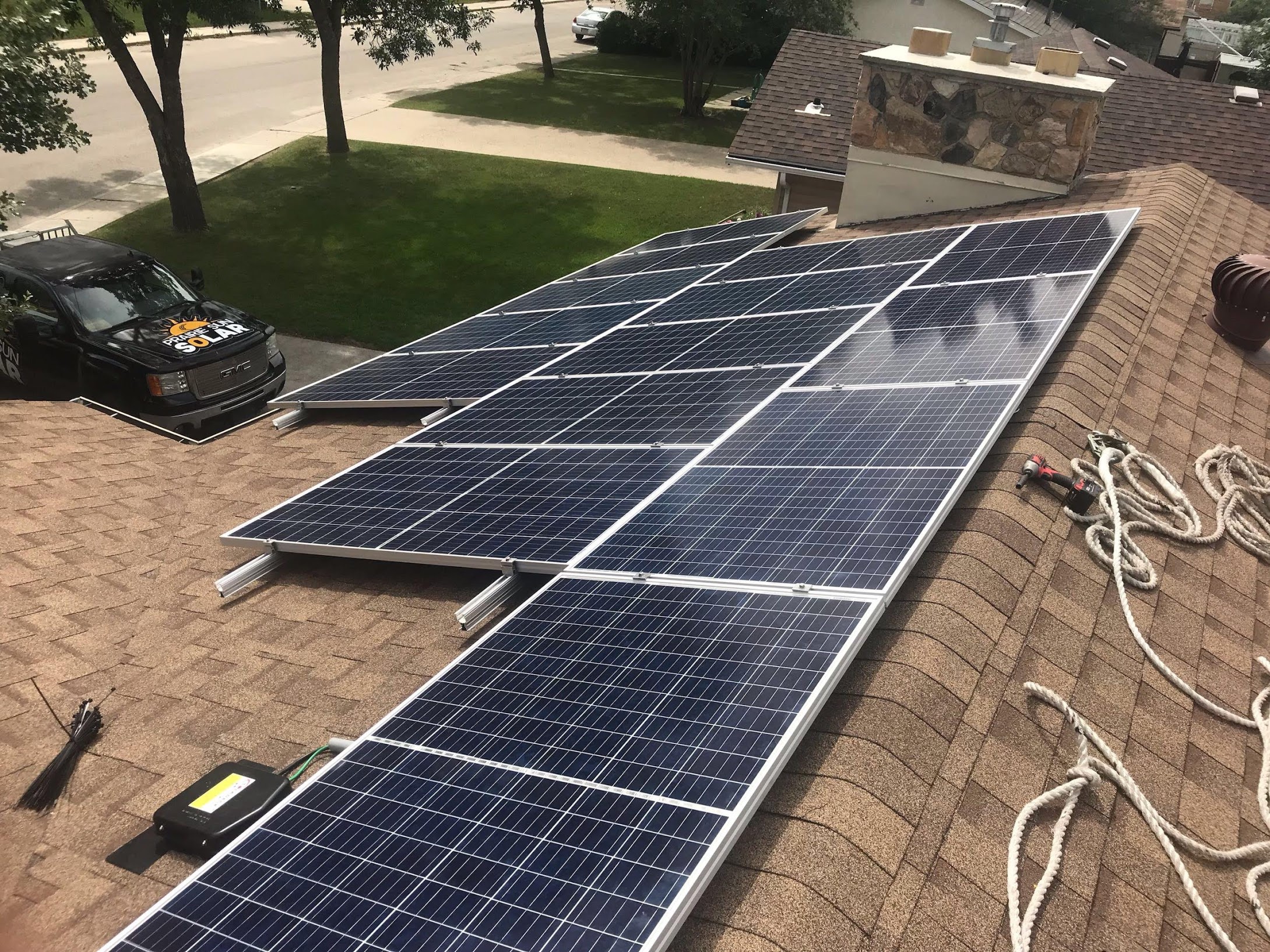 Solar panel installation in progress showing mounting rails and equipment
